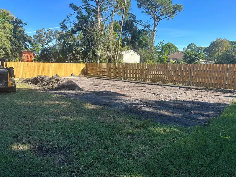 Before: Backyard site cleared and graded before building a pickleball court
